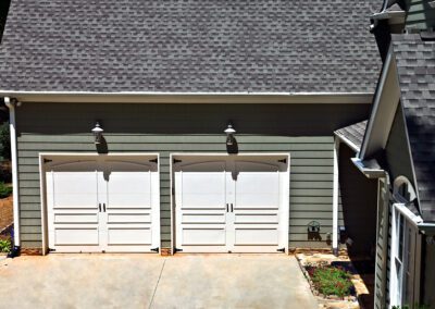 Attached garage on a house showing the doors.